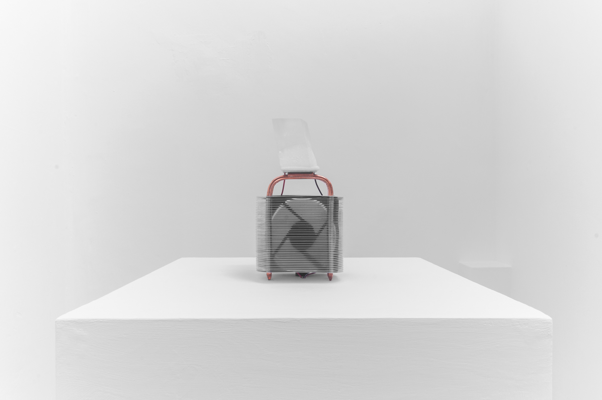 Maria Gondek, Rimfrost, 2015, 12x20x12 cm, Silfurberg stone, Peltier cooling plate, Heat sink, Fan.
