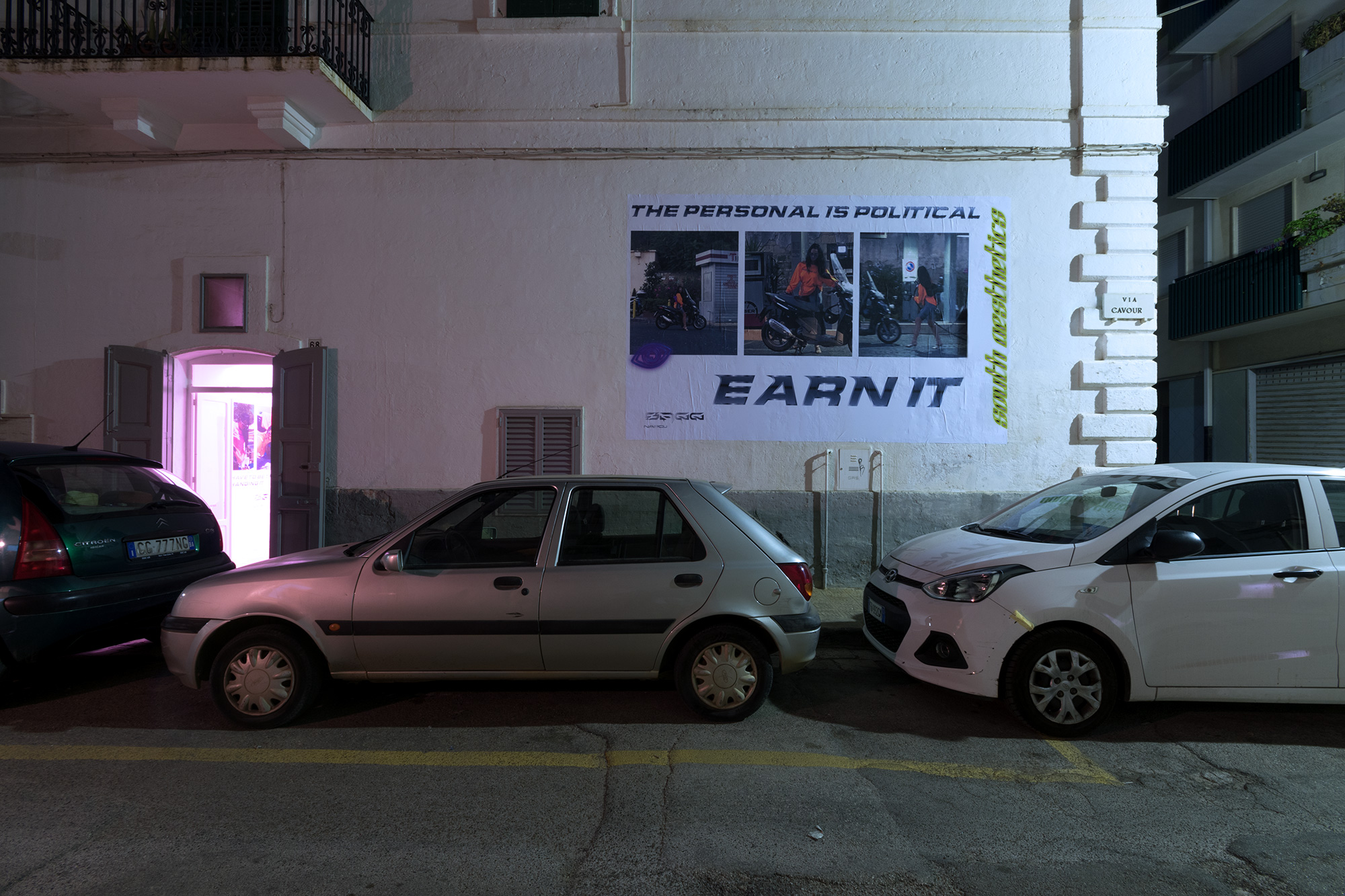 SAGG Napoli, The personal is political - Earn it. 2018 - Digital collage on billboard, lights, 500 x 350 cm. (Night view)
